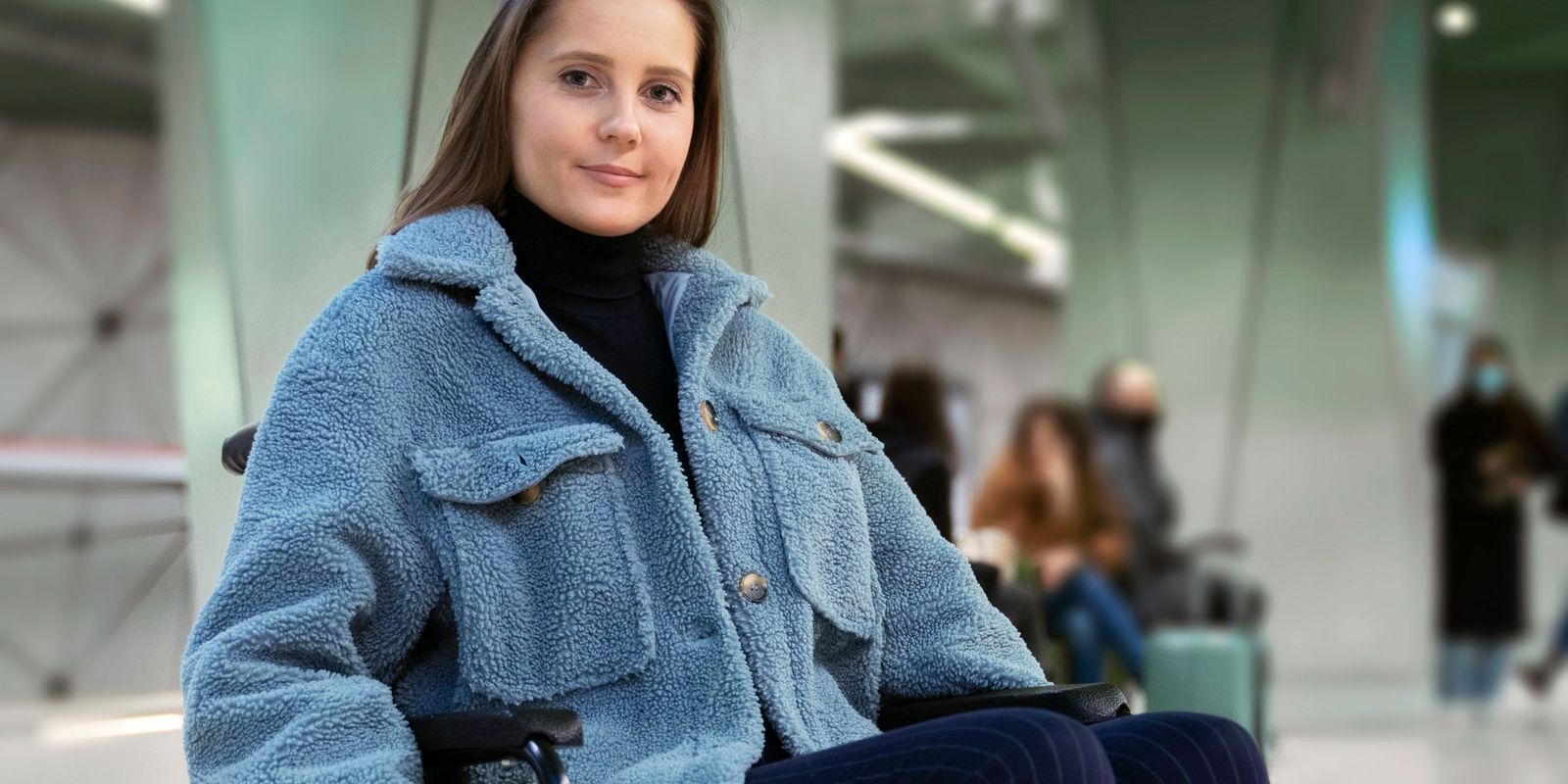 A wheelchair-bound female smiling | Source: Freepik
