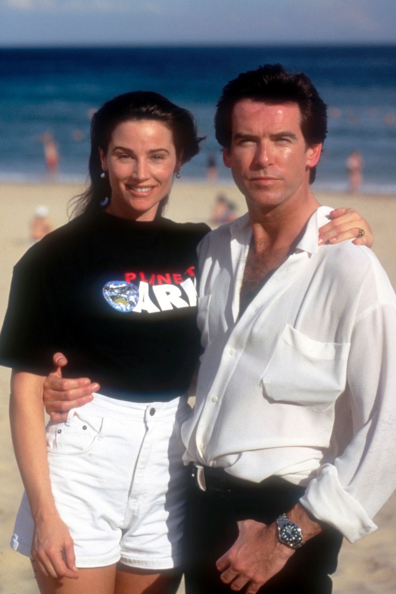 Keely wore a "Planet Earth" T-shirt while posing with Pierce in Sydney in 1995, years before she directed the environmental documentary "Poisoning Paradise." | Source: Getty Images.